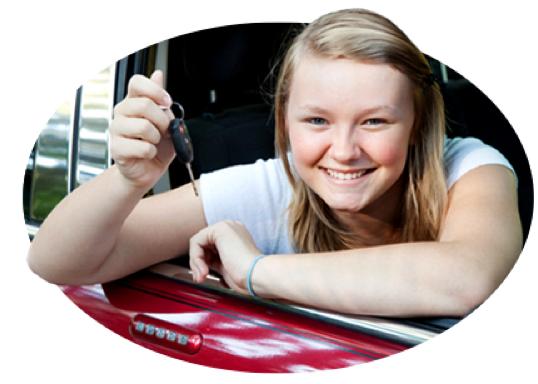 A smiling teen holds up the 车 keys as a good student reward.